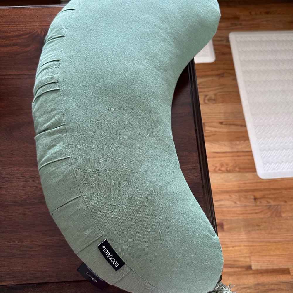 Green DocAtot wedge pillow for nursing